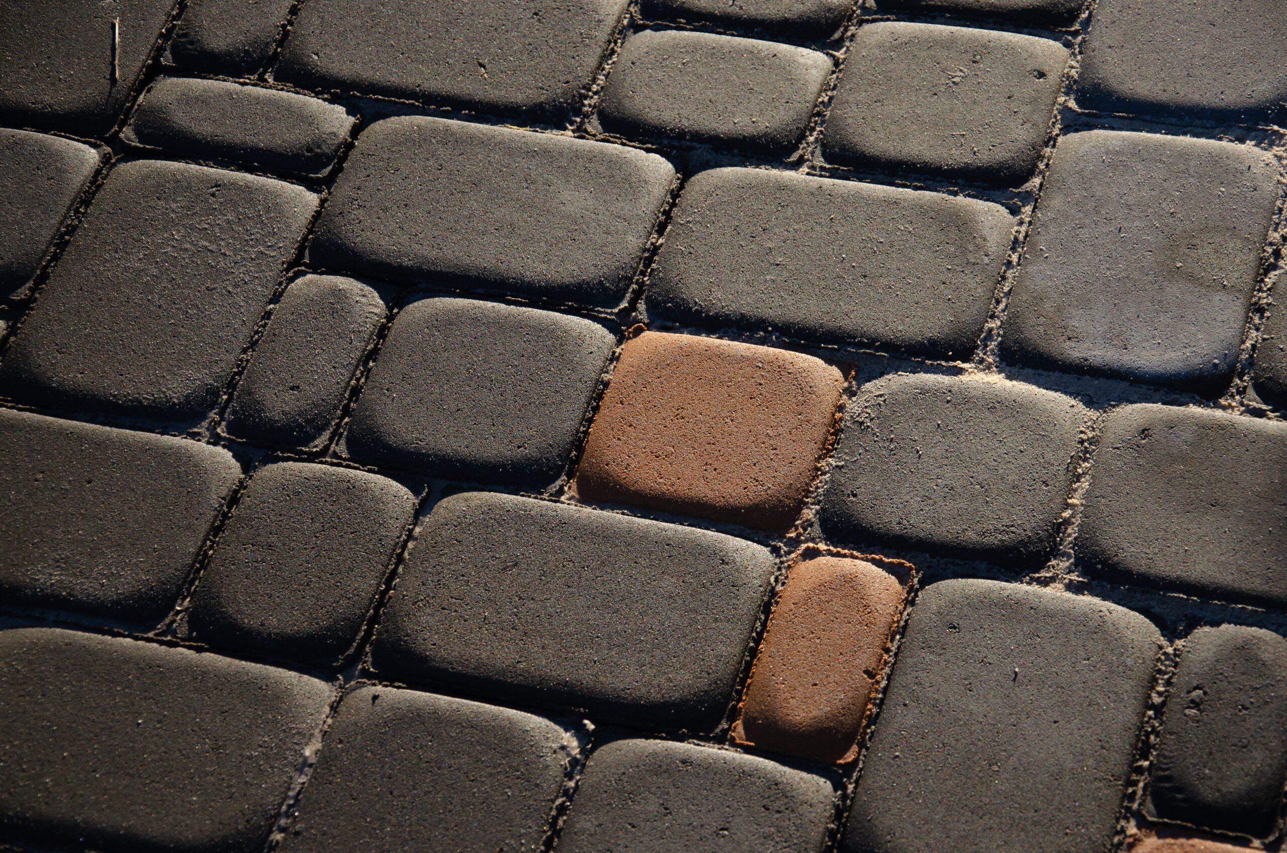 background of old cobblestone pavement close-up.